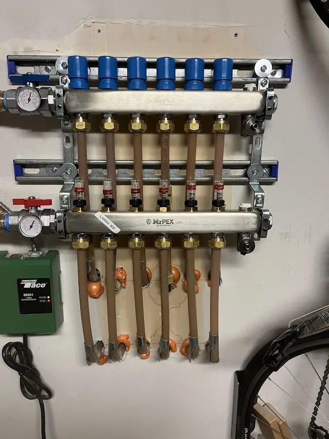 Plumber performing Gas Line Installation at a residential property in New Carlisle